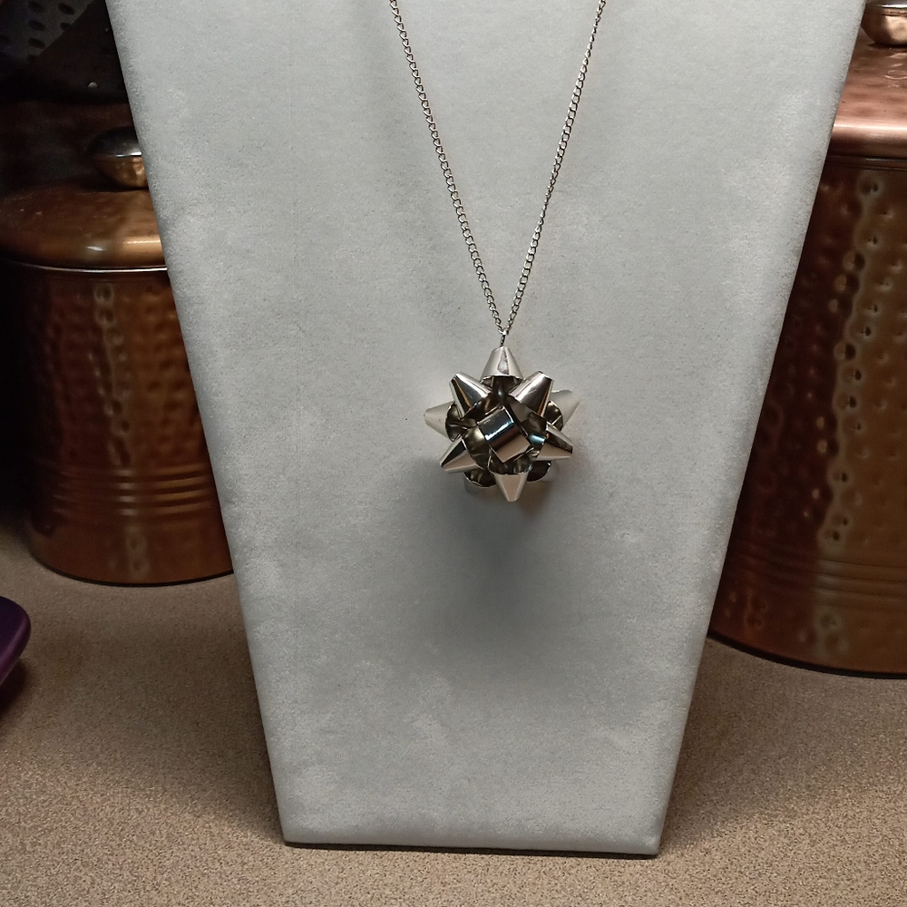 Silver gift bow necklace
